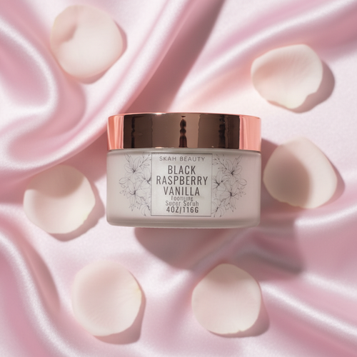 Black Raspberry Vanilla 4oz Foaming Sugar Scrub on pink silk background with rose petals